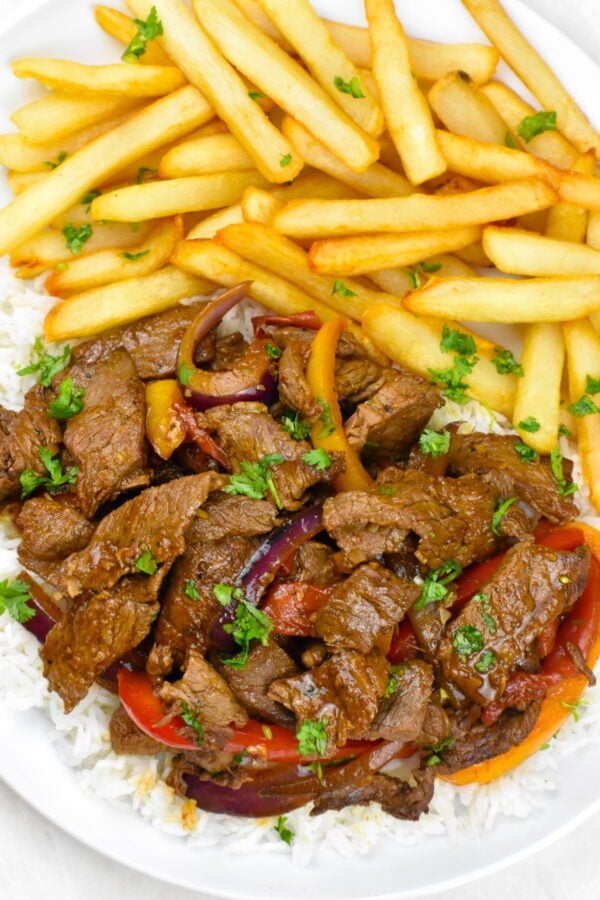 Lomo Saltado Mastering the Chinese-Peruvian Stir-Fry with Tender Beef, Blistered Veggies, and Crispy Fries