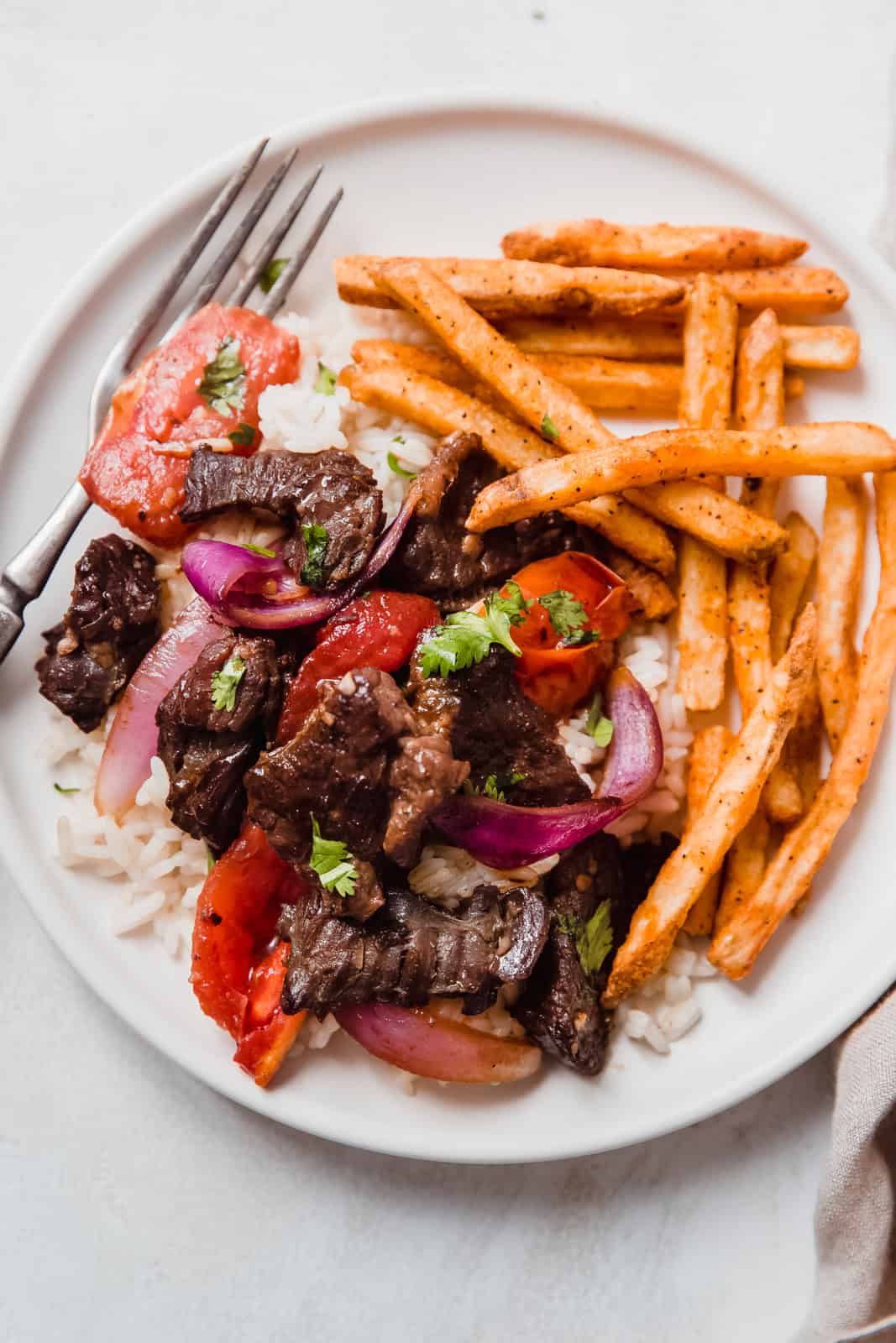 Lomo Saltado Mastering the Chinese-Peruvian Stir-Fry with Tender Beef, Blistered Veggies, and Crispy Fries